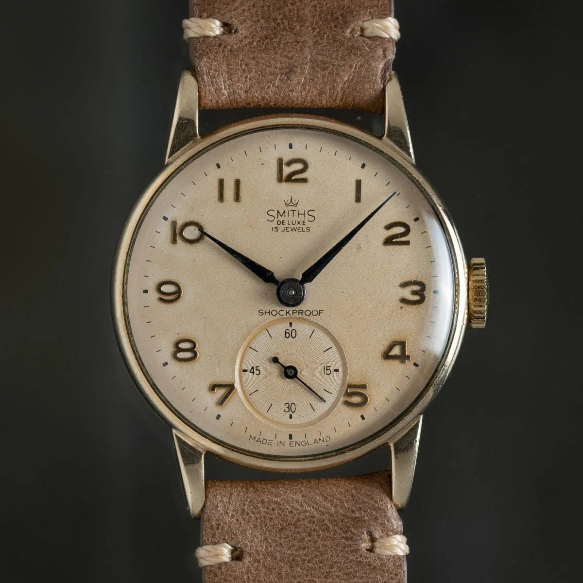 Smith Deluxe en or 9K massif, calibre 1215, remontage manuel, années 1960