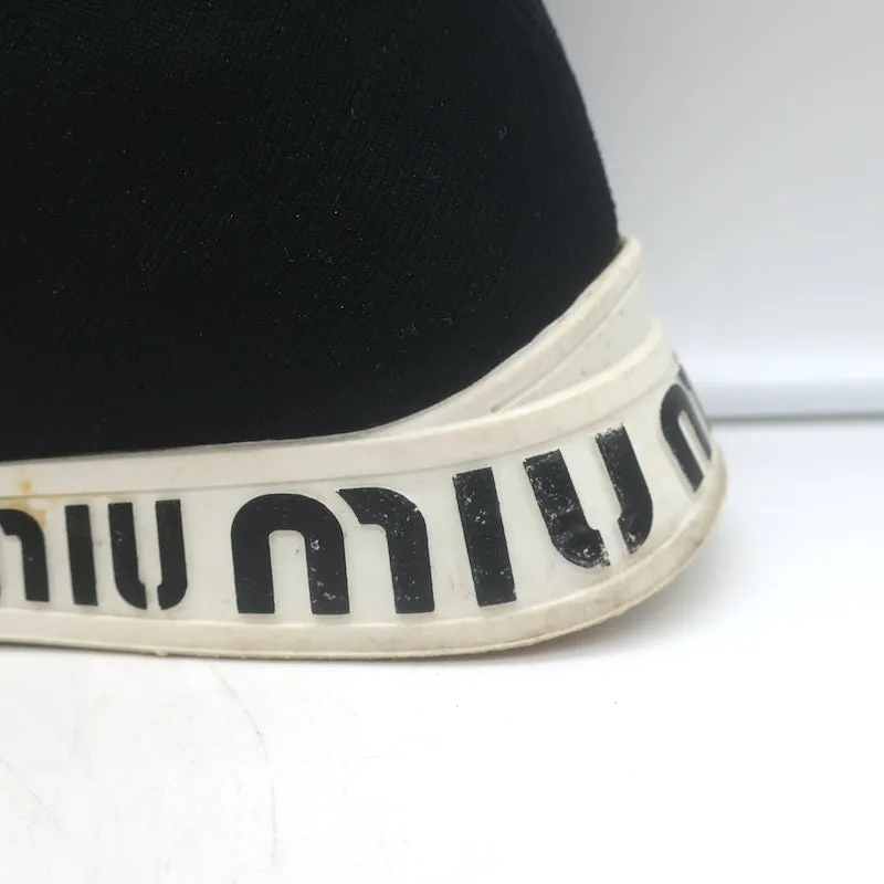 Baskets Miu Miu à logo avec chaussettes intégrées en maille extensible noire taille 38